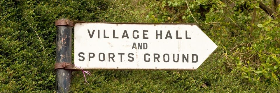 A sign saying village hall and sports ground