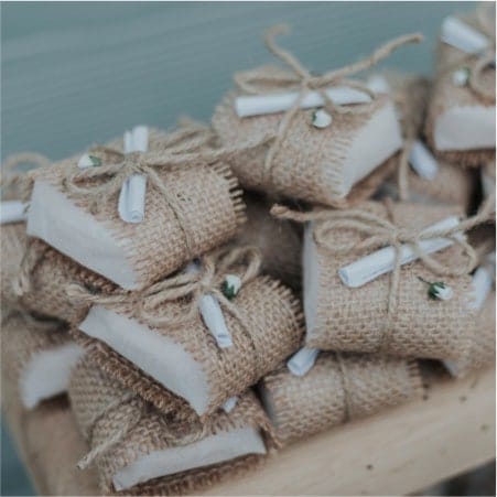 Parcels wrapped in material and string with rolled notes