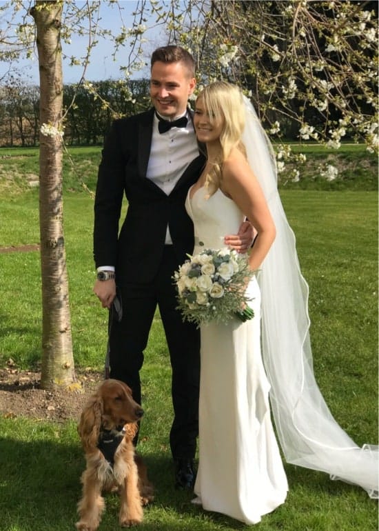 Bride and Groom with dog and flowers taken on iPhone 7s+