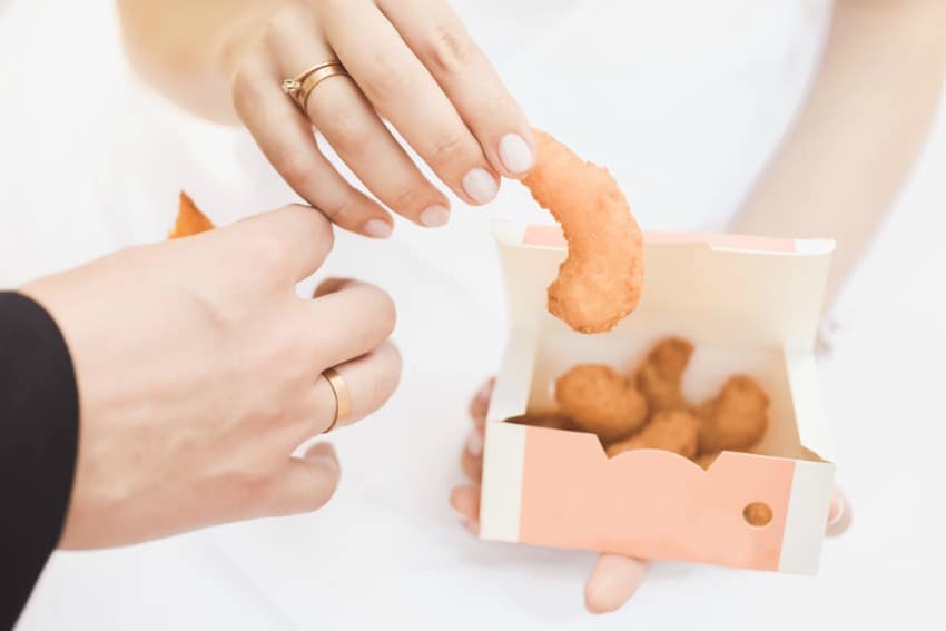 Image of bride and groom eating