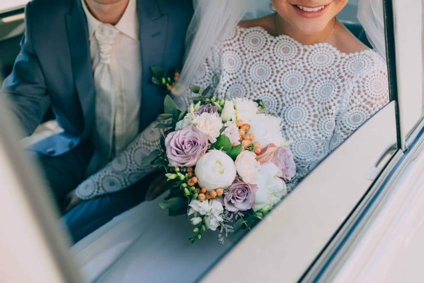 Image of bride and groom in forgotten wedding expenses transportation