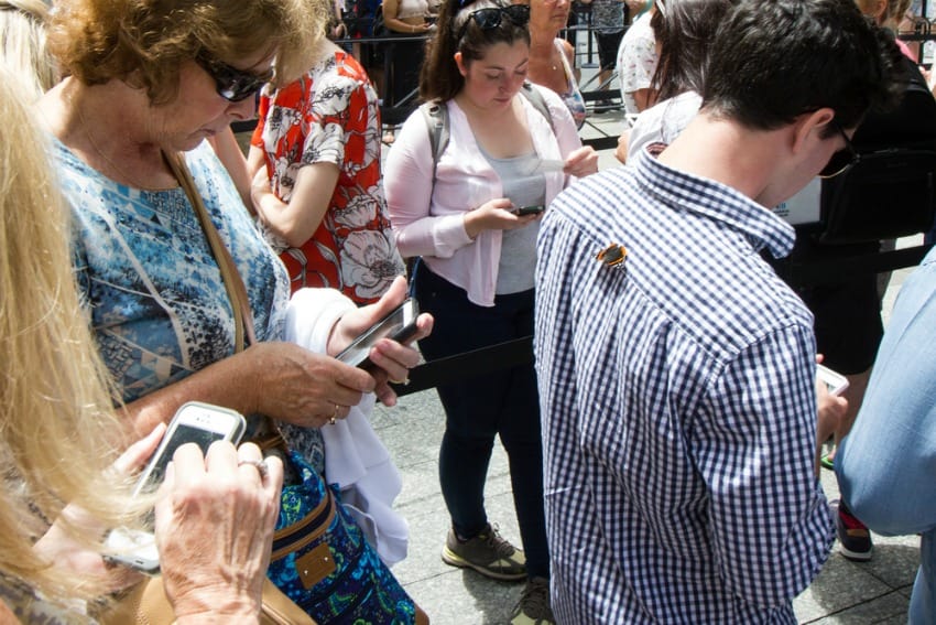 Image of crowd distracted by mobile phones