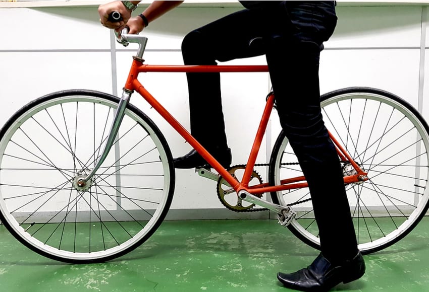 Image of man cycling to work