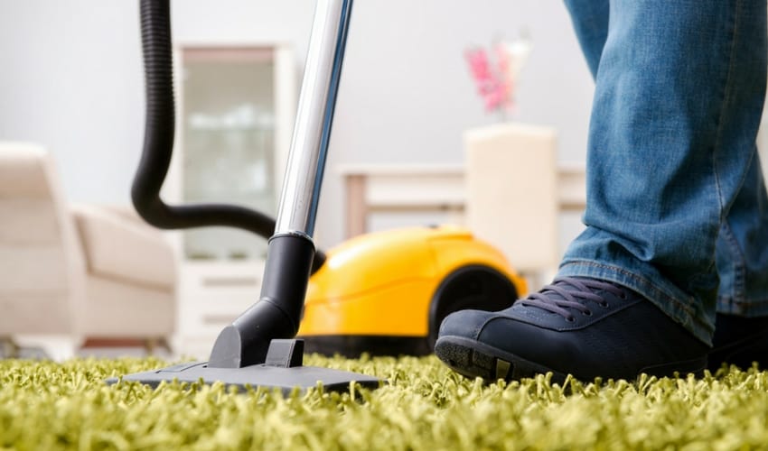 Image of man hoovering