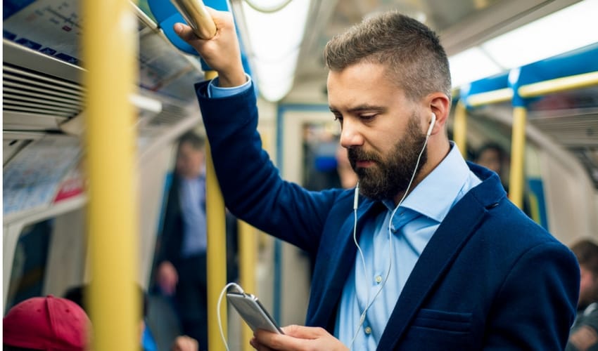 Man on tube listening to music
