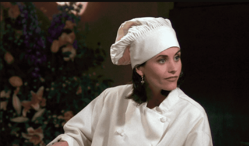 Image of Monica from Friends in chef gear