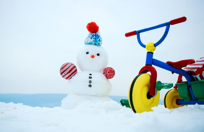 Snowman and tricycle