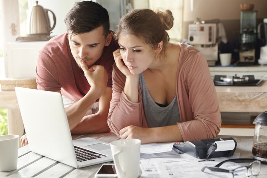 Couple looking at finances together