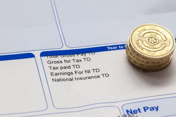 Payslip with pound coins