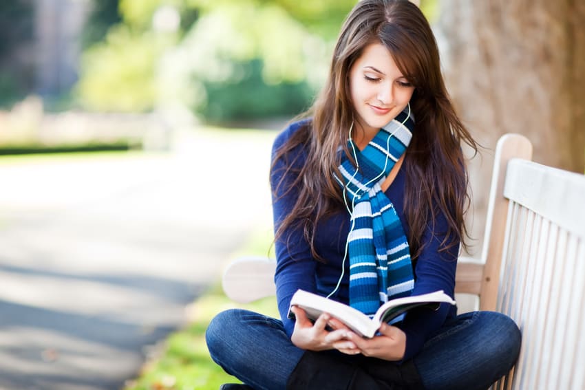 Pretty girl reading key to happiness