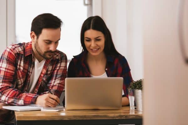 Couple using laptop