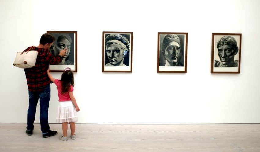 Father and daughter at a gallery