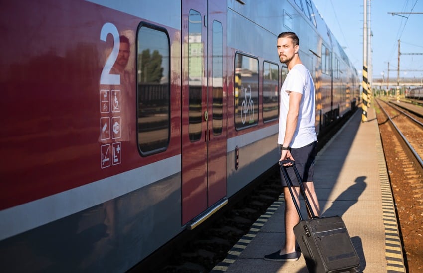 Man getting on train in Europe