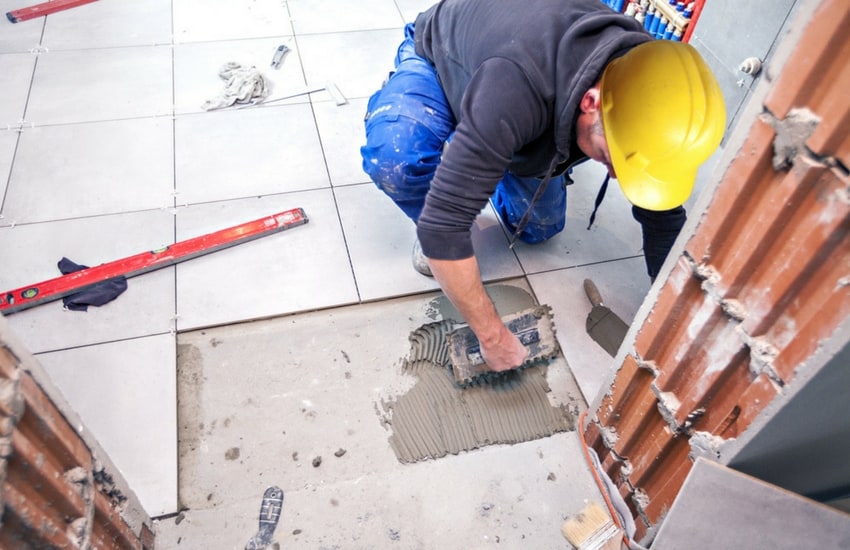 Man laying tiles