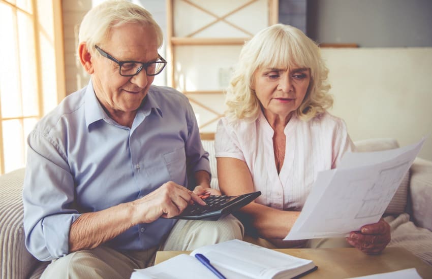 Older couple looking at bills