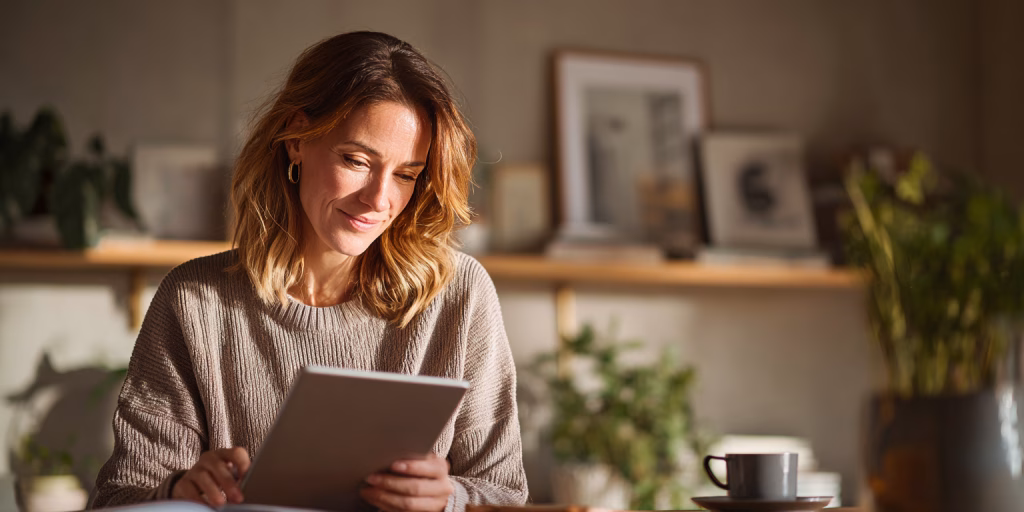 British woman reviewing no guarantor loan options independently at home