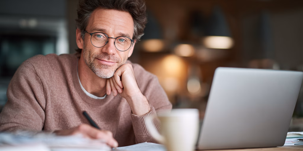 British person comparing different loan amount options on tablet at home