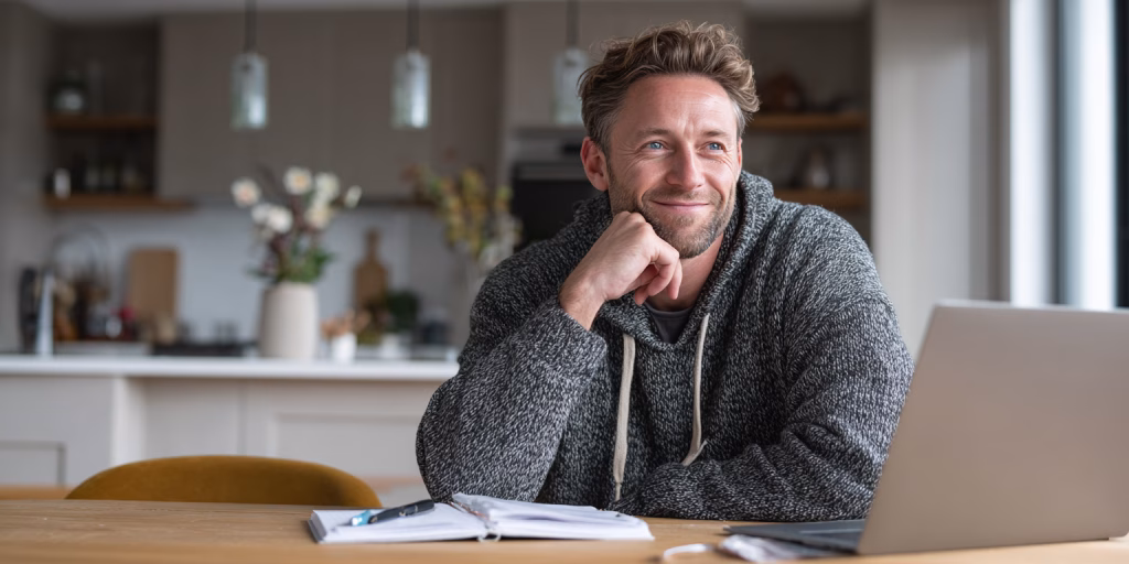 Person reviewing emergency loan alternatives in UK home