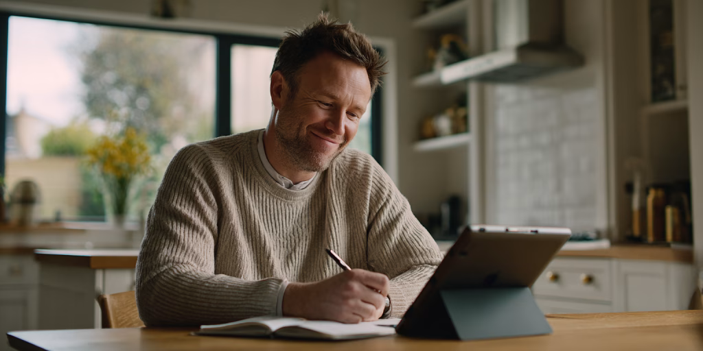 Person comparing same day loan options on tablet in British home