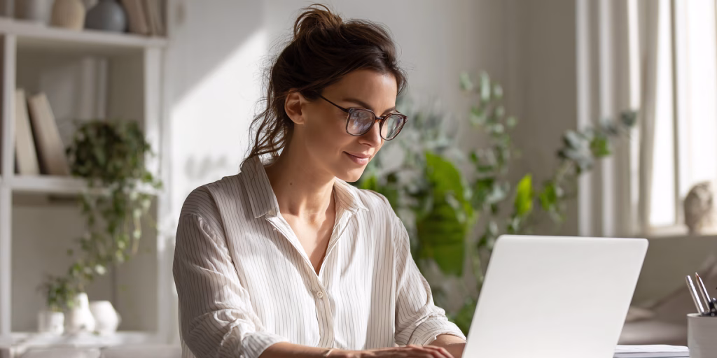 Relieved woman resolving emergency loan situation in modern UK kitchen with natural light