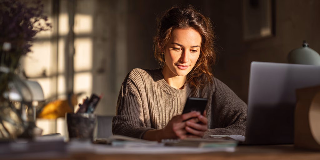 British customer checking same day loan status on smartphone at home