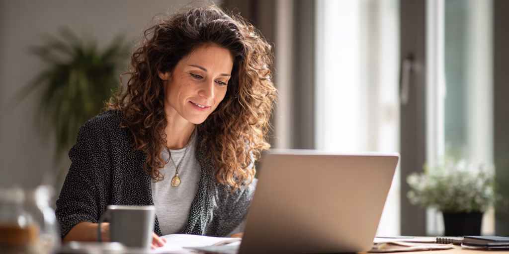British person receiving instant 24 hour loan decision on laptop