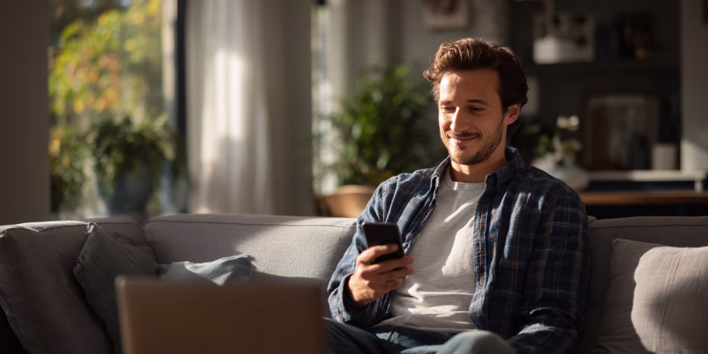 Person receiving instant loan approval on smartphone in British home