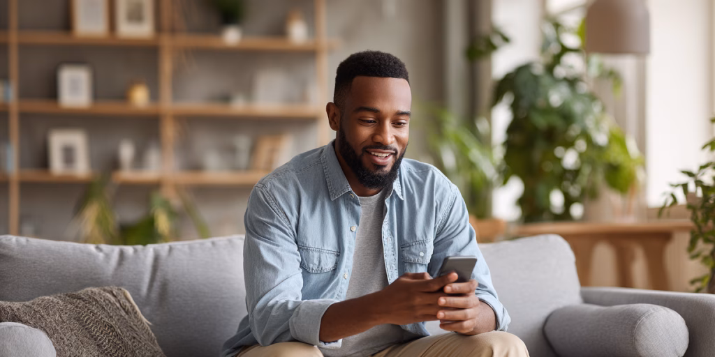 Person receiving instant loan decision on phone in British home