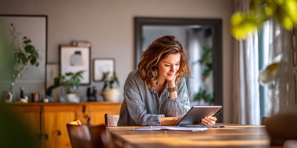 Person comparing no guarantor loan alternatives on tablet in UK home
