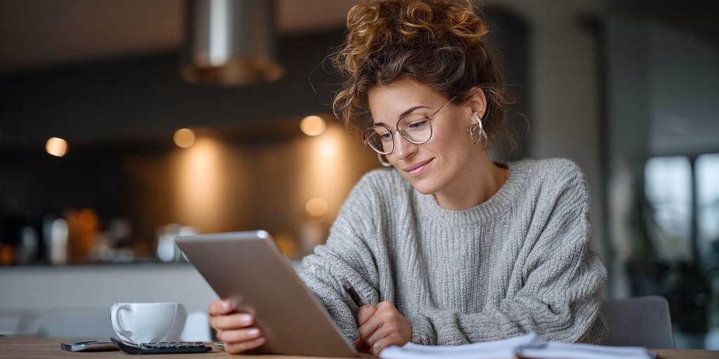 Person comparing quick loan alternatives on tablet in UK home